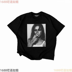 Black tee with a monochrome portrait print, product photo from the seller