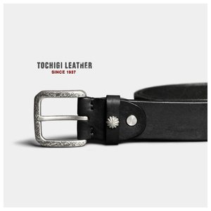 Vegetable-tanned belt with a carved buckle, product photo from the seller